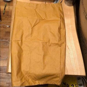 A Mustard , below the knee pencil skirt